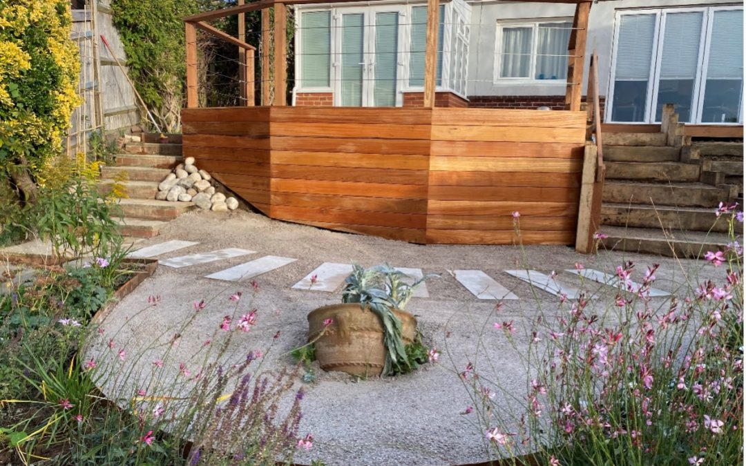 HARDWOOD DECK AND RUSTIC WATER-FEATURE INSTALLATION